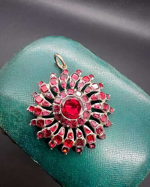 Flat-cut Garnet Sunburst Pendant