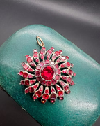 Flat-cut Garnet Sunburst Pendant